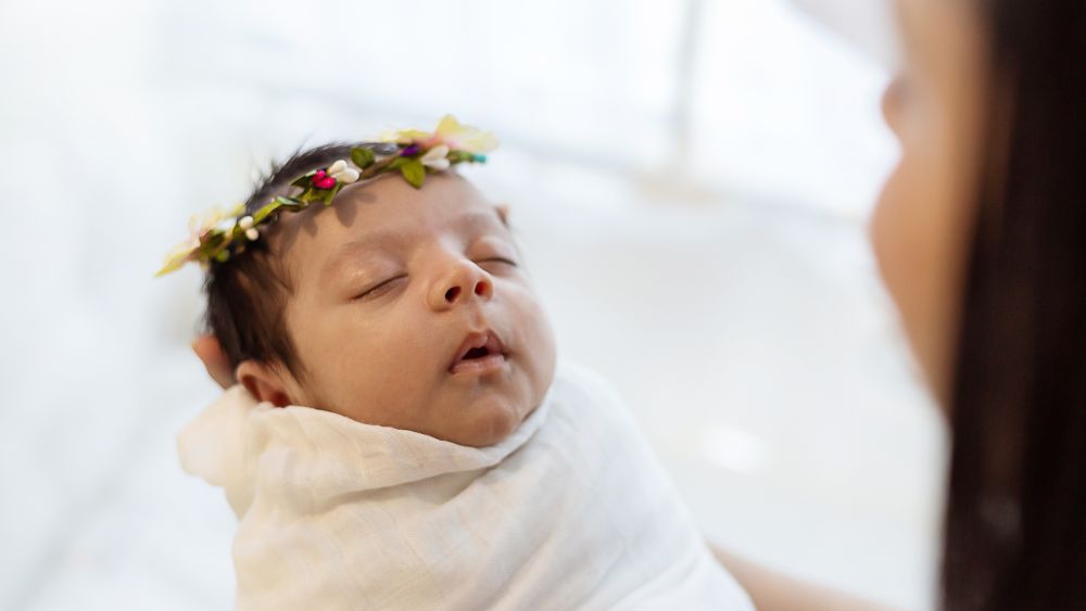 swaddled newborn baby sleeping